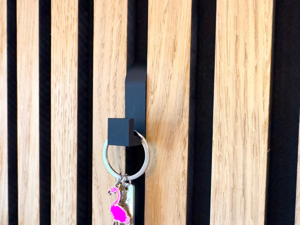 No-Drill Acoustic Panel Hooks holding key chain on a modern acoustic panel